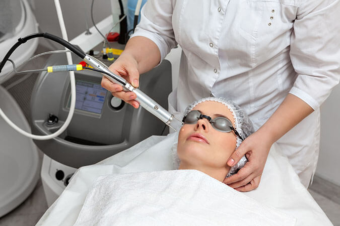 Laser treatment on patient face